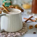 Cozy dairy free oatmeal cinnamon latte styled by food photographer with a cinnamon stick