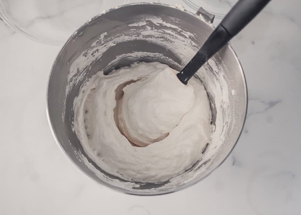 stage of mixing macaron batter by hand smoother