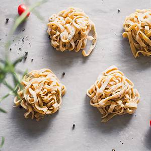Freshly made balls of homemade pasta with rosemary