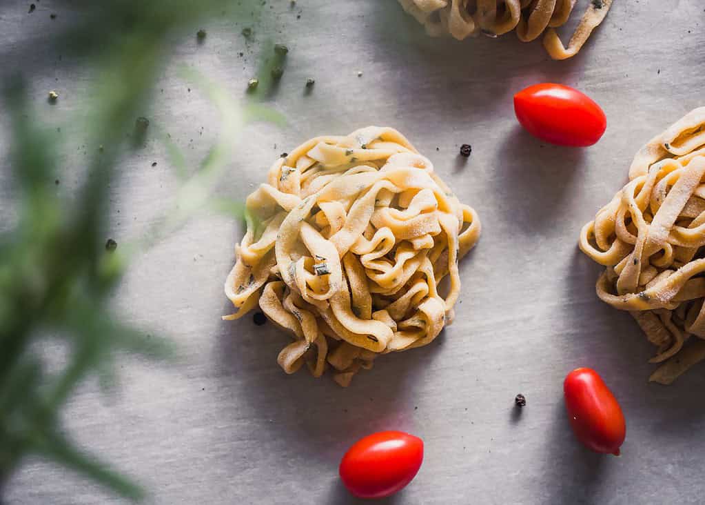 fresh pasta with rosemary and tomato