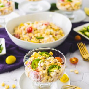 Sweet corn salad served in a clear glass dish