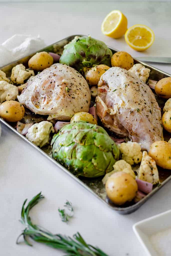 uncooked sheet pan chicken and veggies